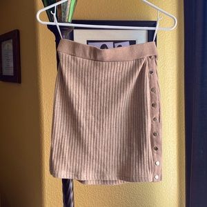 Mimi/mid light tan skirt, snatches at the waist and hugs curves perfectly.